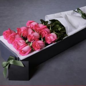 12 pink roses in a box.